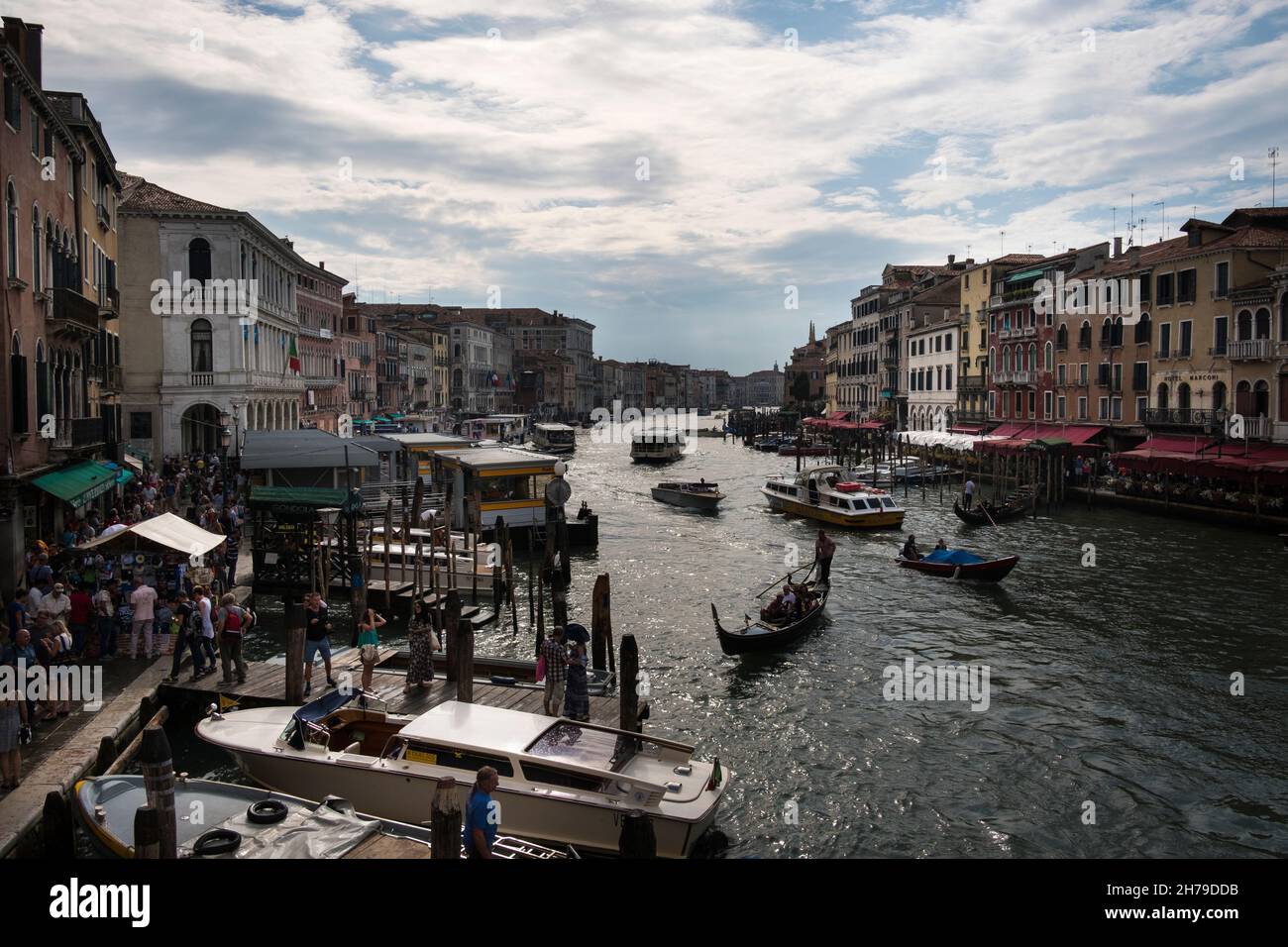 Water taxis, gondolas and other boats along the Grand Canal viewed from the Ponte di Rialto, Venice, Italy. Stock Photo