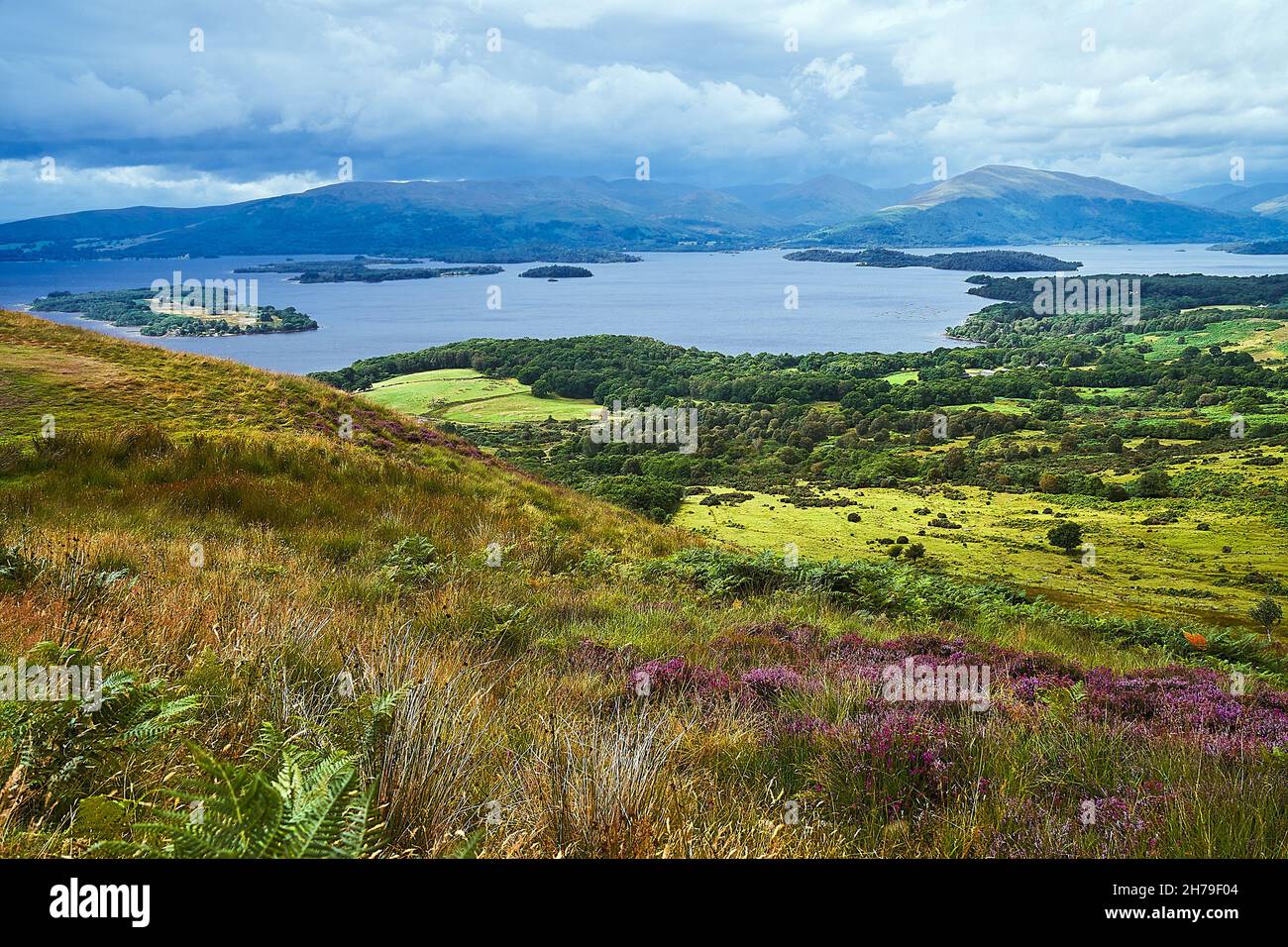 View of Loch Lomond and Scottish Mountains under dark skies from Conic