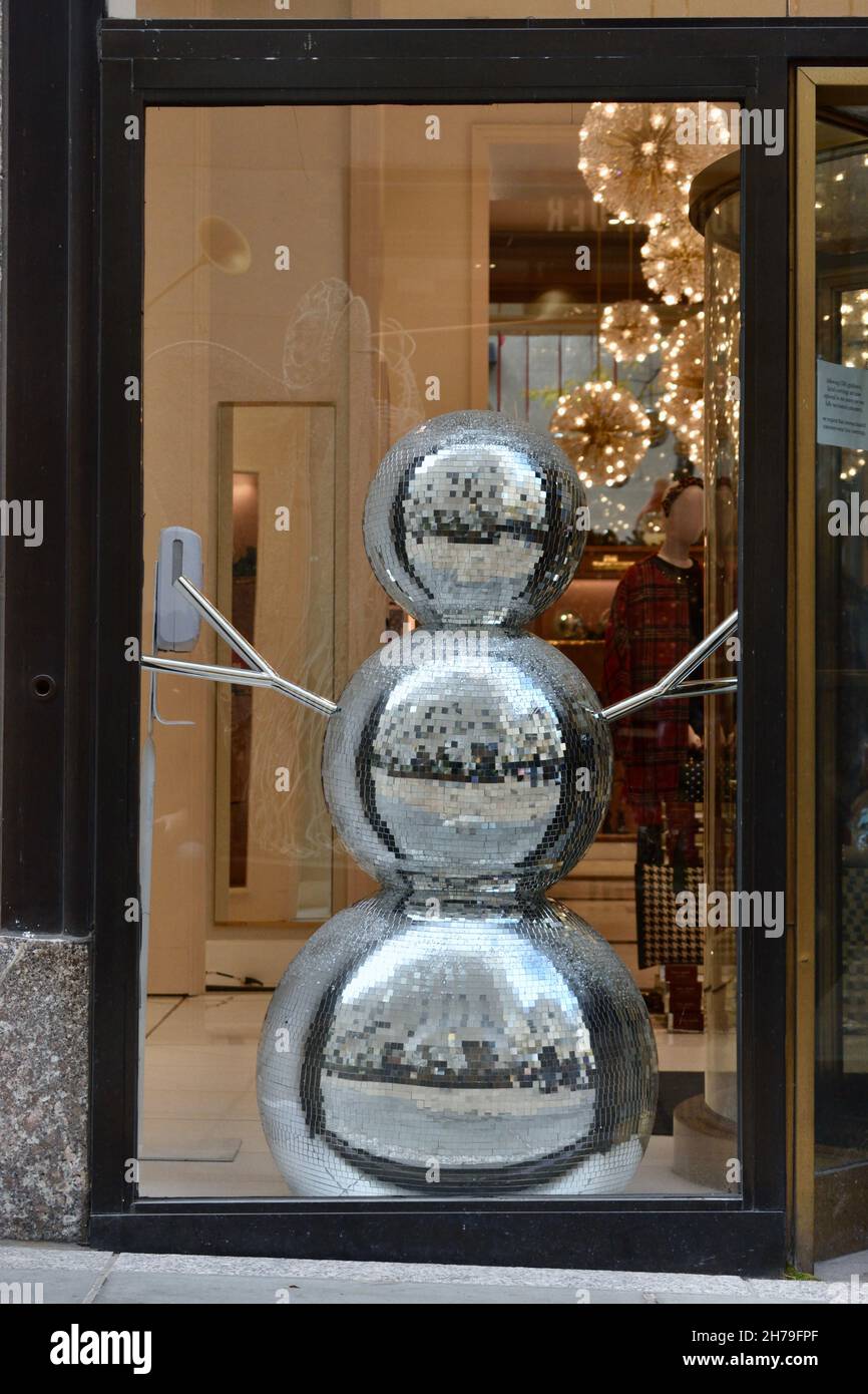 Silver Disco Ball Snowman in a shop window, November 21, 2021, in New York. Stock Photo