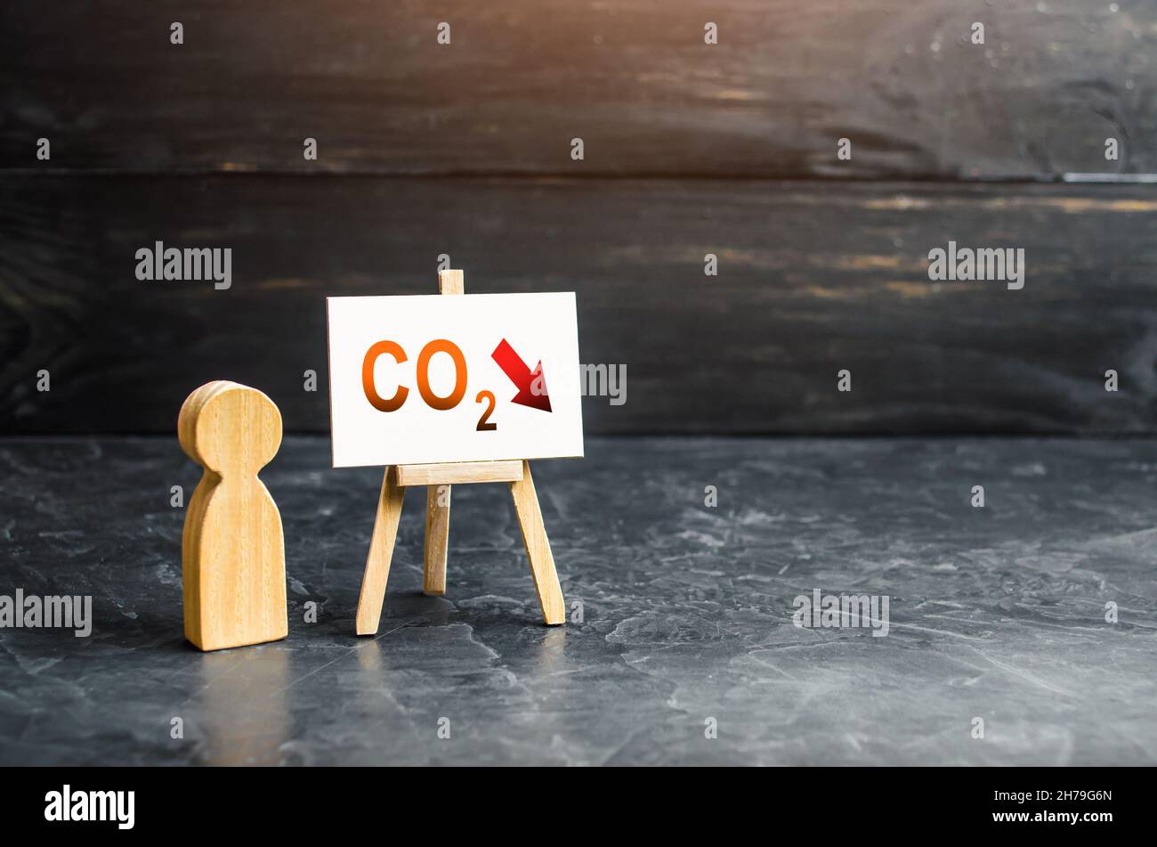 Reducing greenhouse gas emissions CO2 easel. Environmentally friendly. Improving energy efficiency. Carbon neutral. Low impact on environment. Decarbo Stock Photo