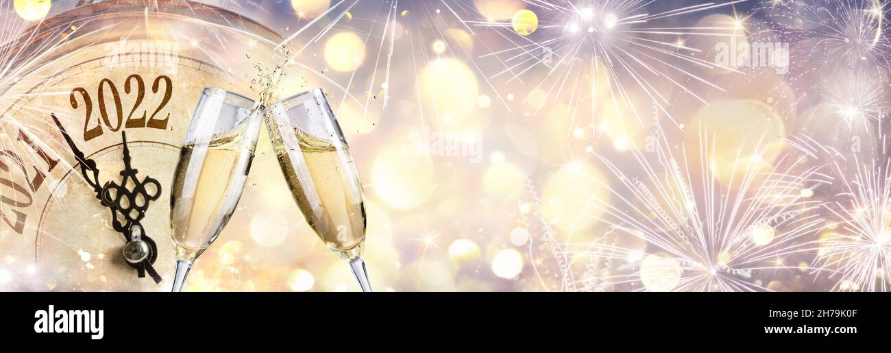 New Year 2022 - Celebration With Champagne And Clock - Abstract Defocused Lights Stock Photo