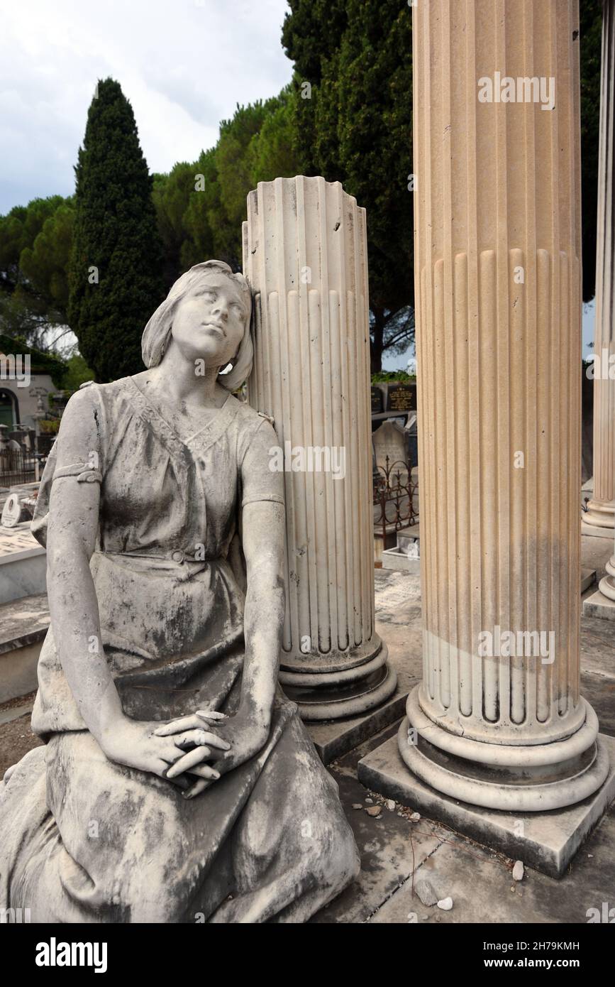 Statue of Mourner or Mourning Womman Leaning Against Classical Columns of Tomb in Jewish Cemetery, or Cimitière Israélite, Nice Alpes-Maritimes France Stock Photo