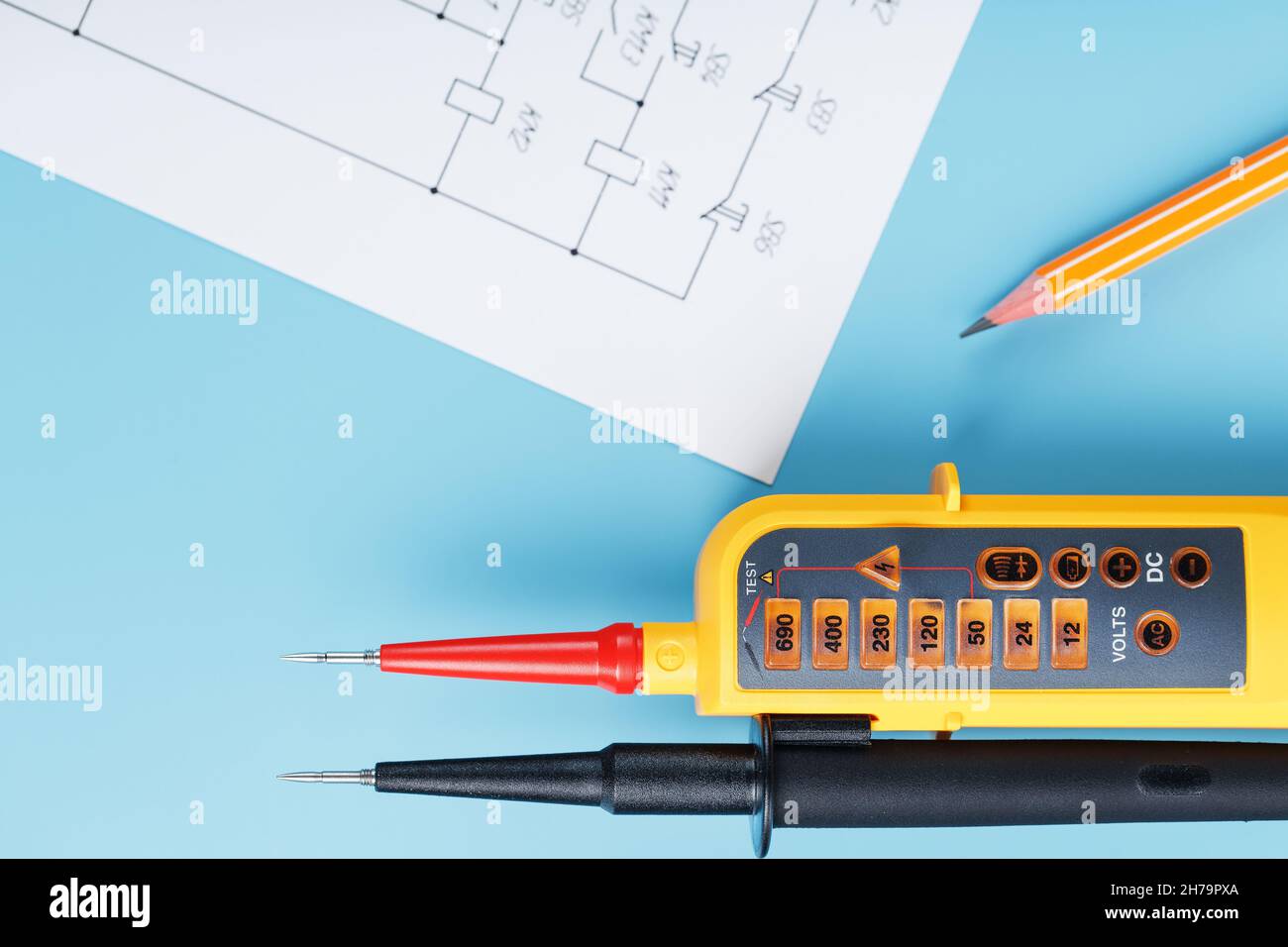 Twopole voltage indicator with electrical drawings on a blue