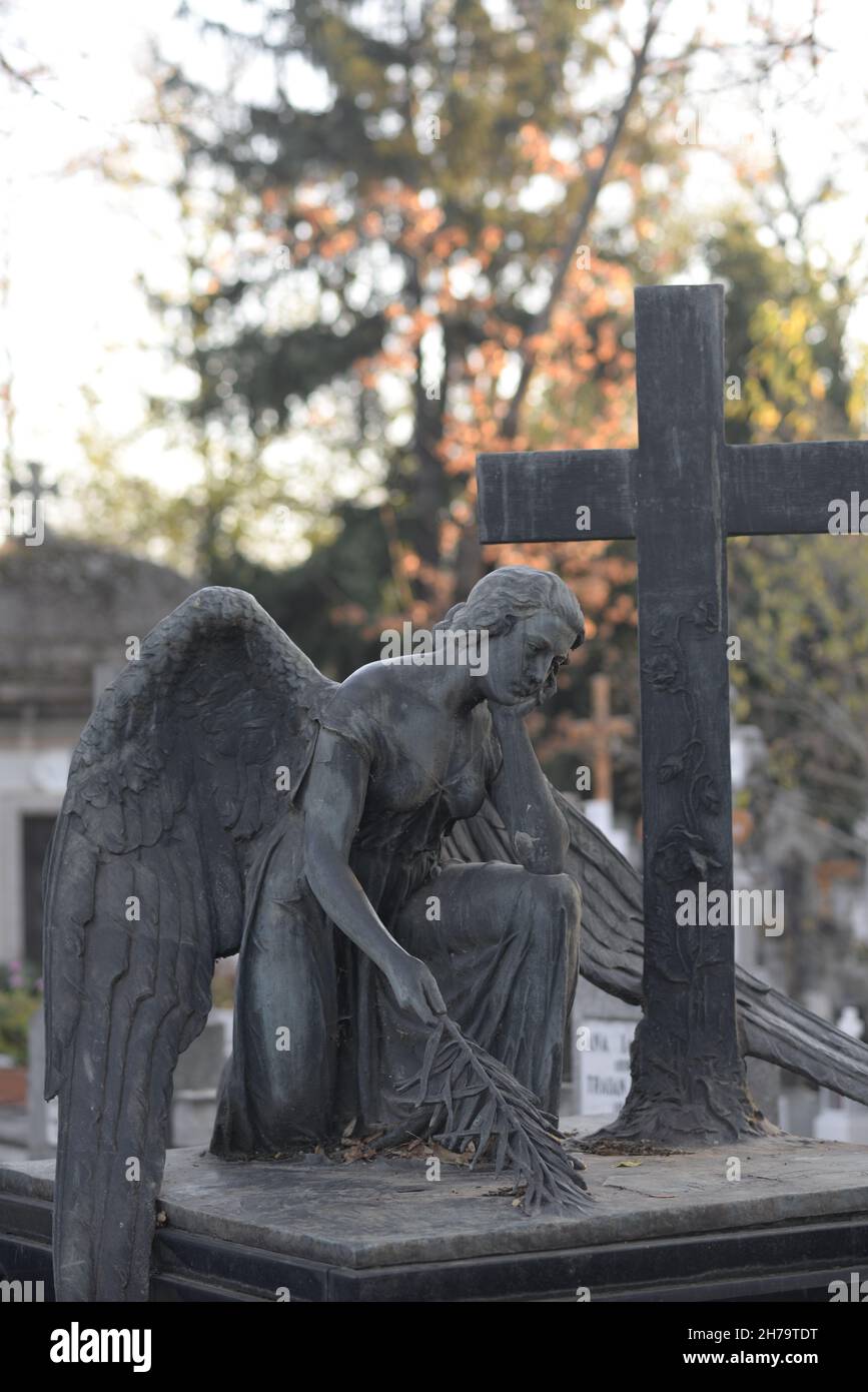 sad angel near cross Stock Photo