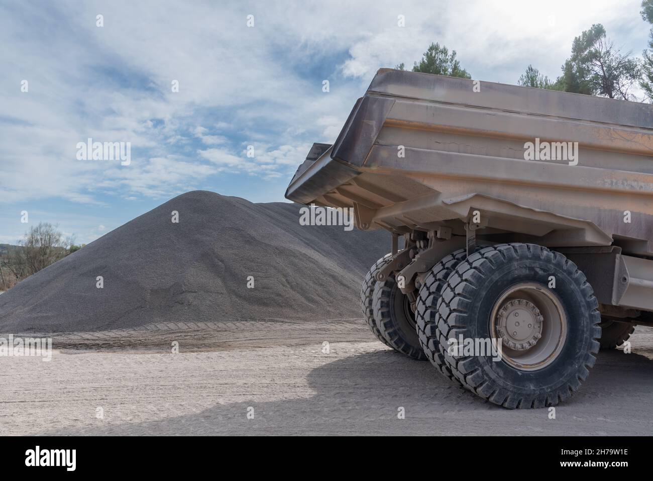 Large dump truck used for moving sand and gravel in quarries. Stock Photo