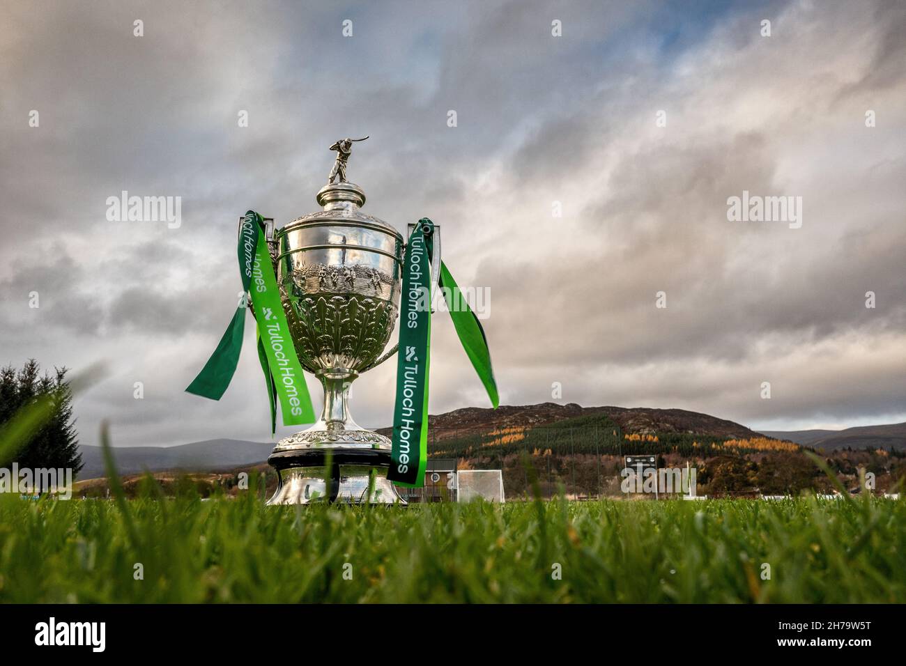 The most important trophy in shinty, the Camanachd Cup pictured on the pitch at The Dell, Kingussie, with the sponsors ribbons showing Tulloch Homes. Stock Photo