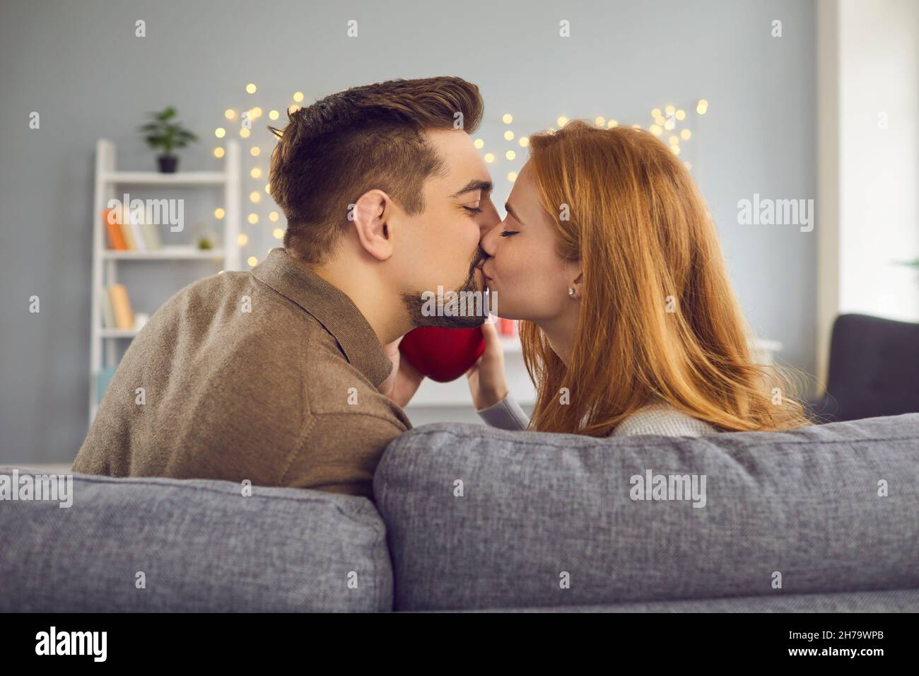 Rear view of a couple kissing and enjoying spending time celebrating Valentine's Day. Stock Photo