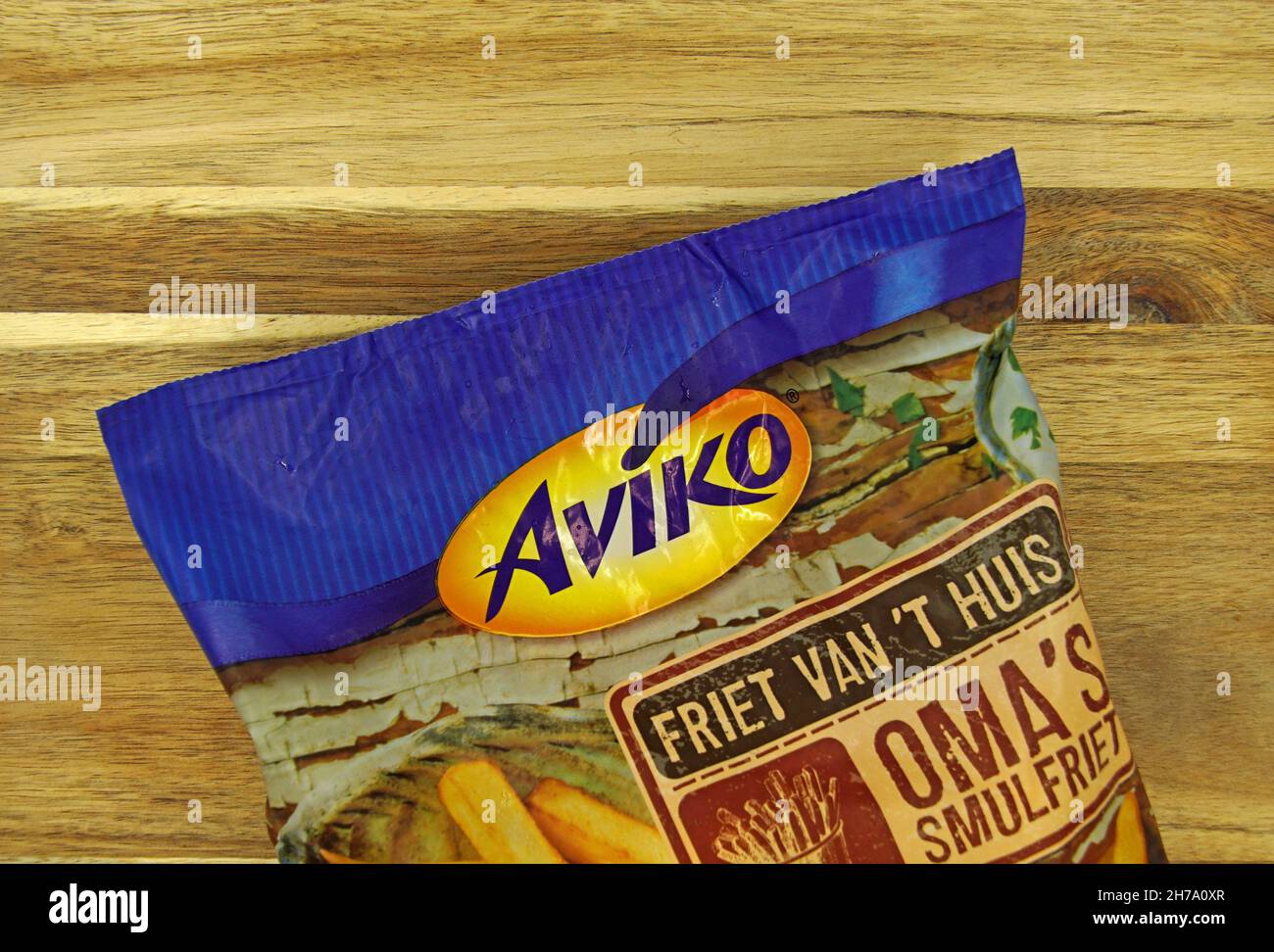 Zaandam, the Netherlands - September 10, 2021: Package of Aviko Oma's smulfriet Fries on a kitchen table. Stock Photo