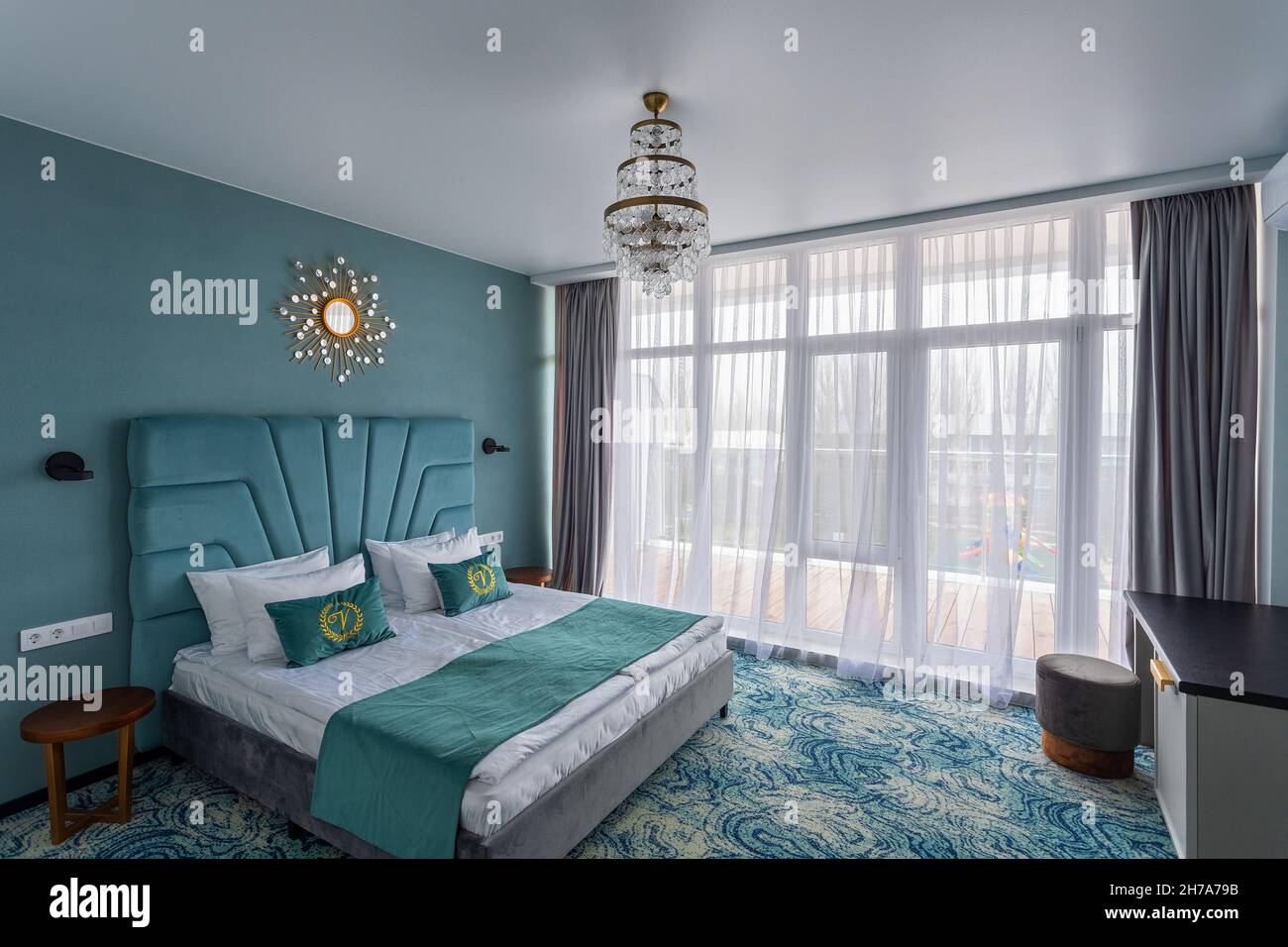 Bedroom in a hotel with a double bed Stock Photo