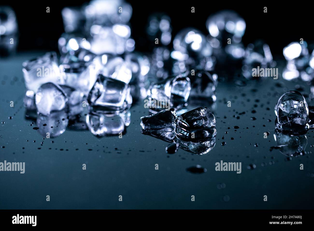 ice cubes reflection on black background. close up Stock Photo - Alamy