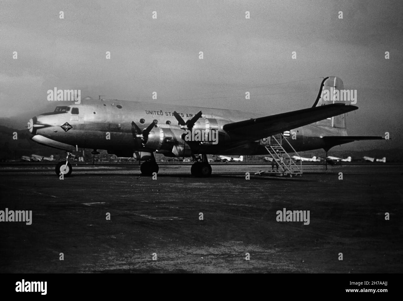 A photograph of a Douglas C-54E transport aircraft of the United States Air Force, serial number 44-9149, taken at Seoul during the Korean War, in 1953 or 1954. Stock Photo