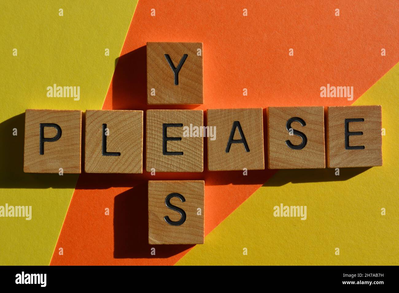 Yes Please, words in wooden alphabet letters in crossword form isolated