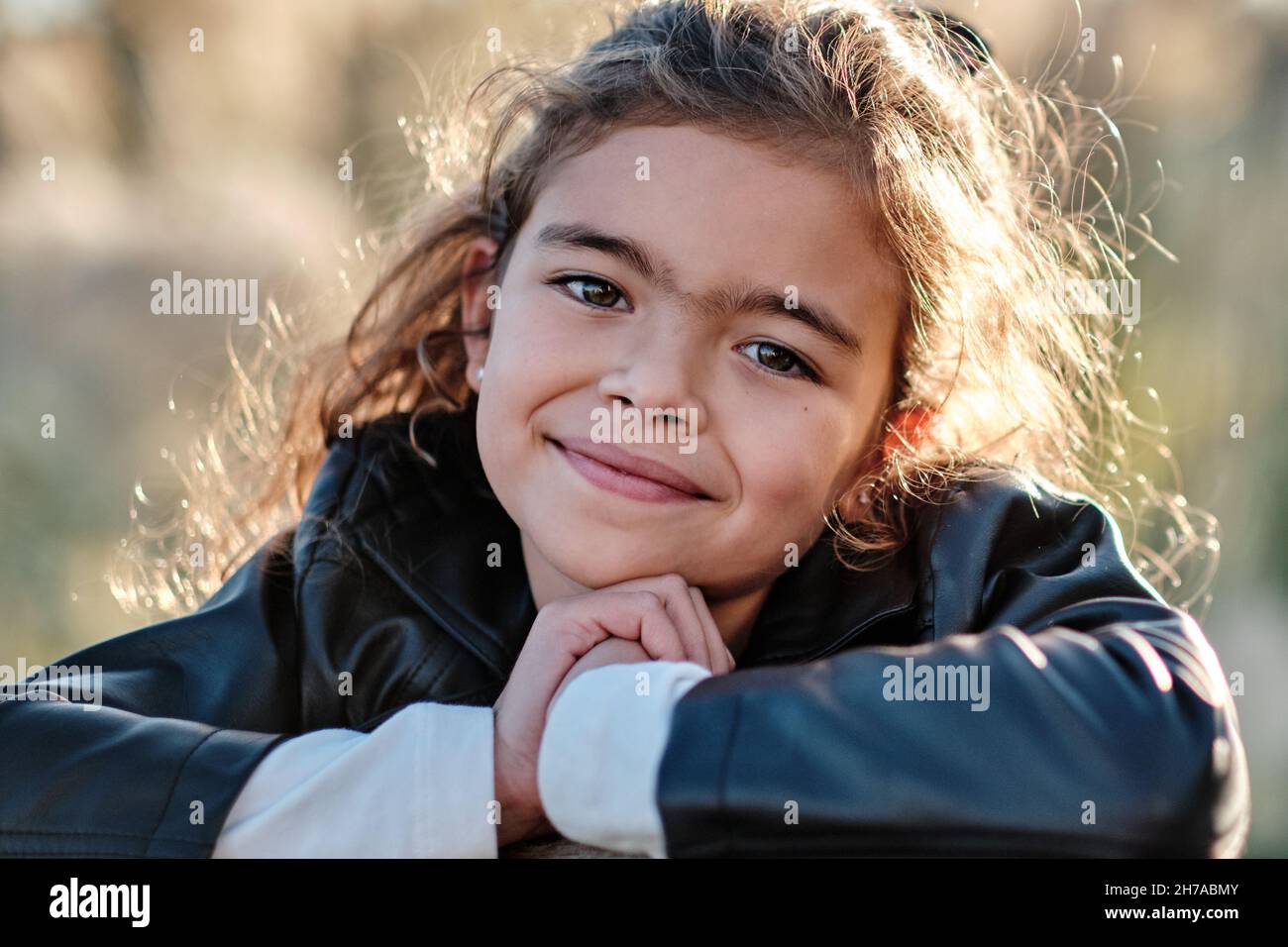 A happy Caucasian girl in the field under the sunlight Stock Photo Alamy