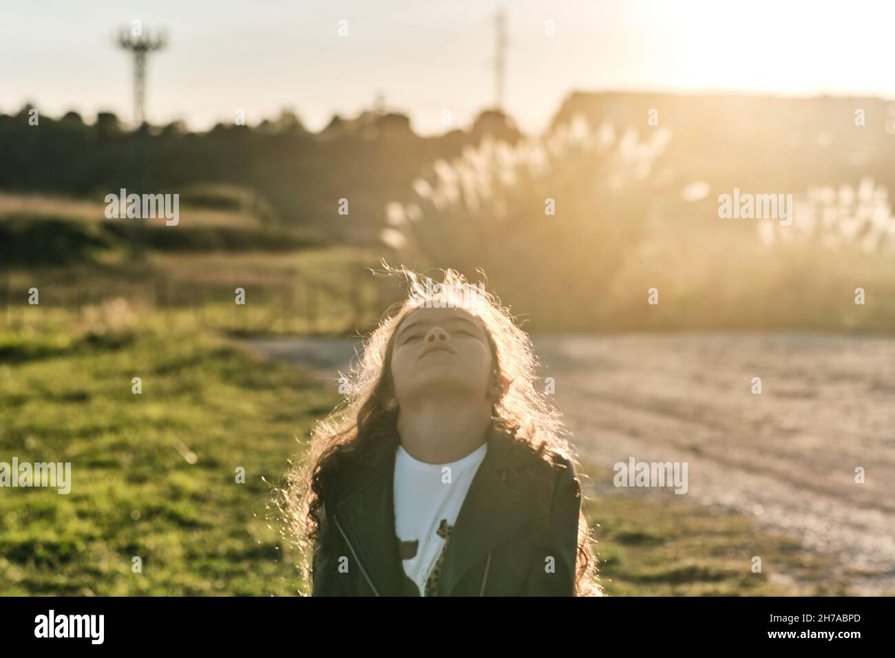 A happy Caucasian girl in the field under the sunlight Stock Photo - Alamy