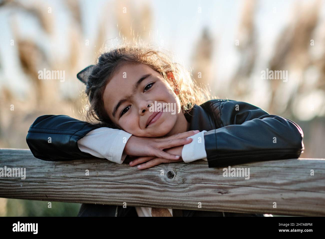 A happy Caucasian girl in the field under the sunlight Stock Photo - Alamy