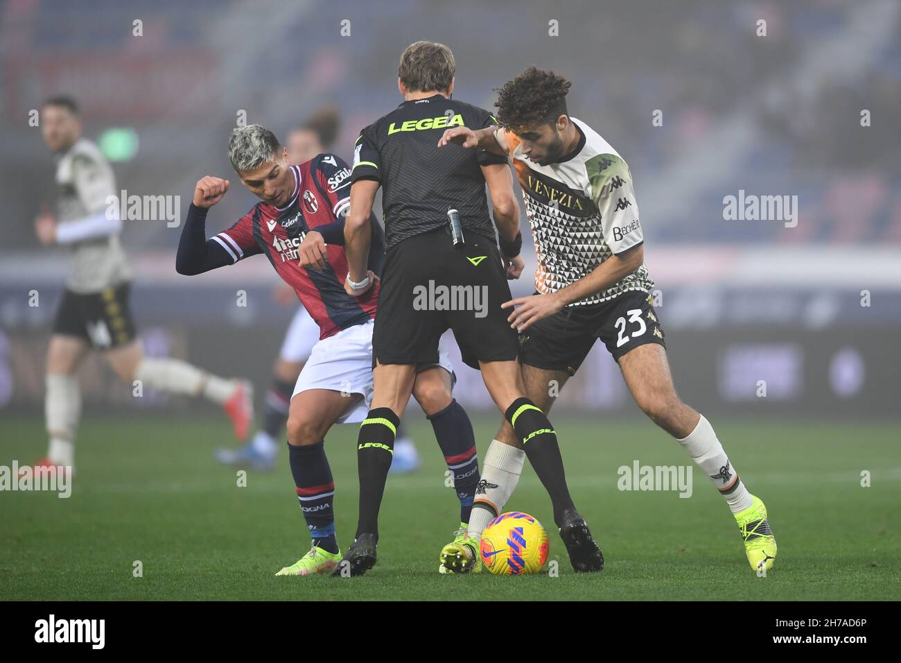 Nicolas Dominguez (Bologna)Daniele Chiffi (Referee)Sofian Kiyine (Venezia) during the Italian 'Serie A' match between Bologna 0-1 Venezia at Renato Dall Ara Stadium on November 21, 2021 in Bologna, Italy. Credit: Maurizio Borsari/AFLO/Alamy Live News Stock Photo