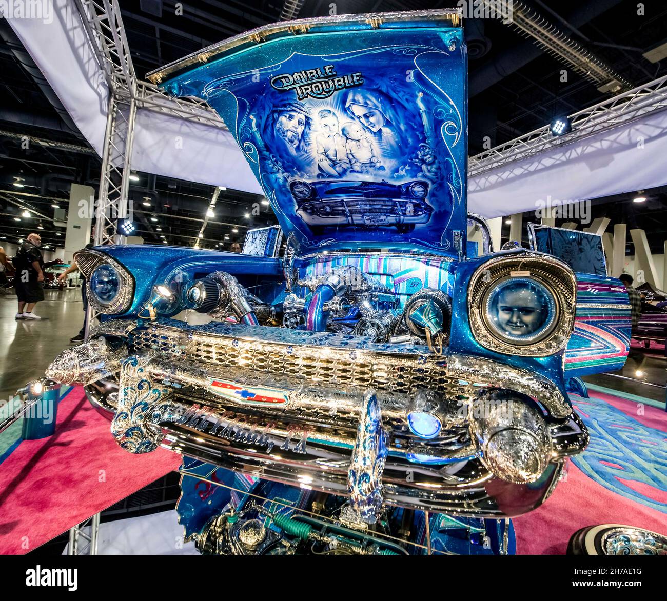 Las Vegas, Nevada, USA. 21st Nov, 2021. The Lowrider Super Show at the Las Vegas Convention Center features some 800 exquisitely painted and customized cars, trucks, motorcycles and bicycles. A tradition in the Mexican American car community since the 1970's, lowriders typically show off intricate artwork depicting and extolling the tradition, culture, faith and family of its creators.(Credit Image: © Brian Cahn/ZUMA Press Wire) Stock Photo
