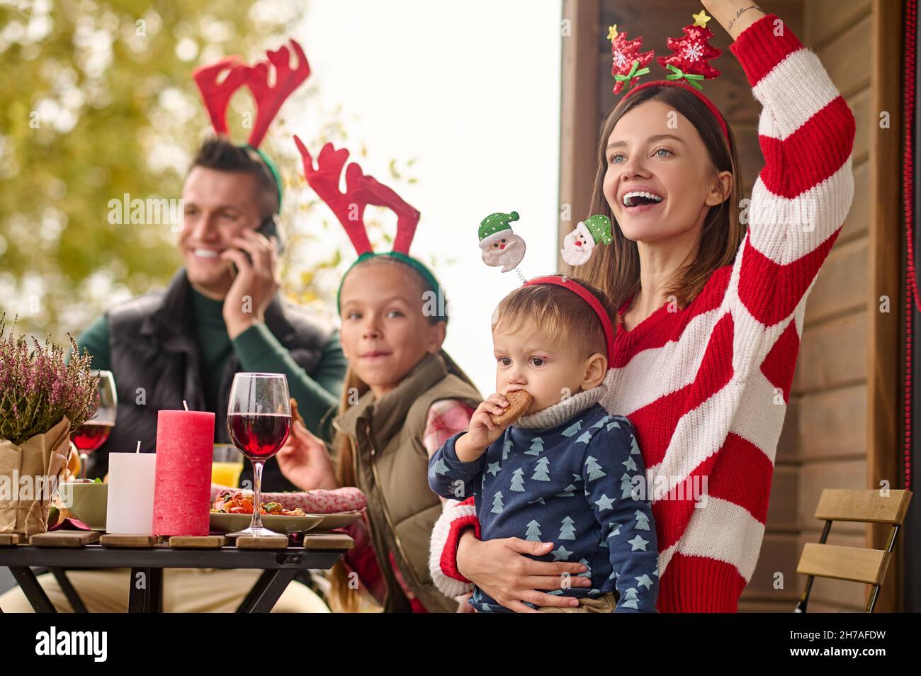 A happy family sitting at the table and celebrating christmas Stock Photo