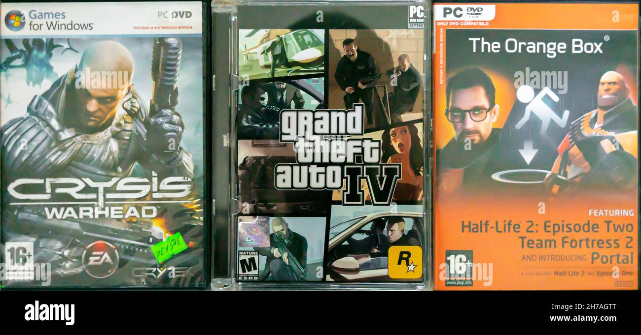 Video Games for Windows PC DVDs covers from 2000s: Crysis Warhead, GTA 4, Half-Life-2. Stock Photo