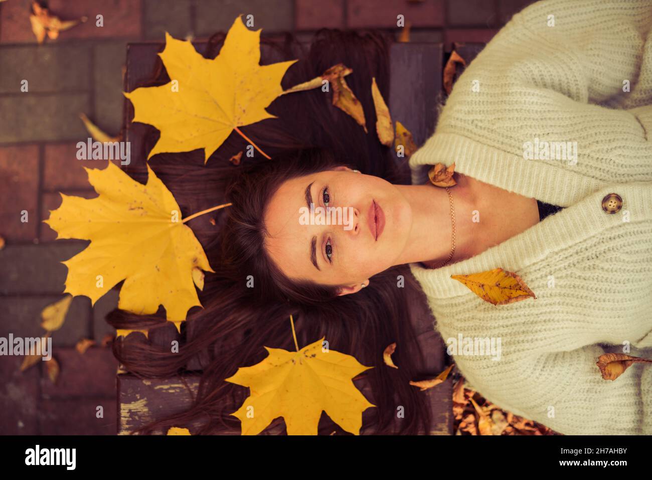young woman portrait with fall season maple leafs Stock Photo - Alamy