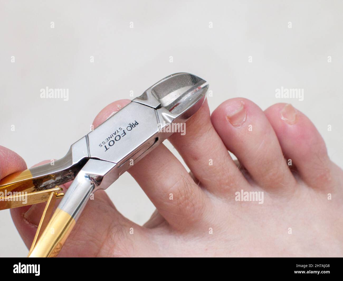 Toenail clippers in use Stock Photo Alamy