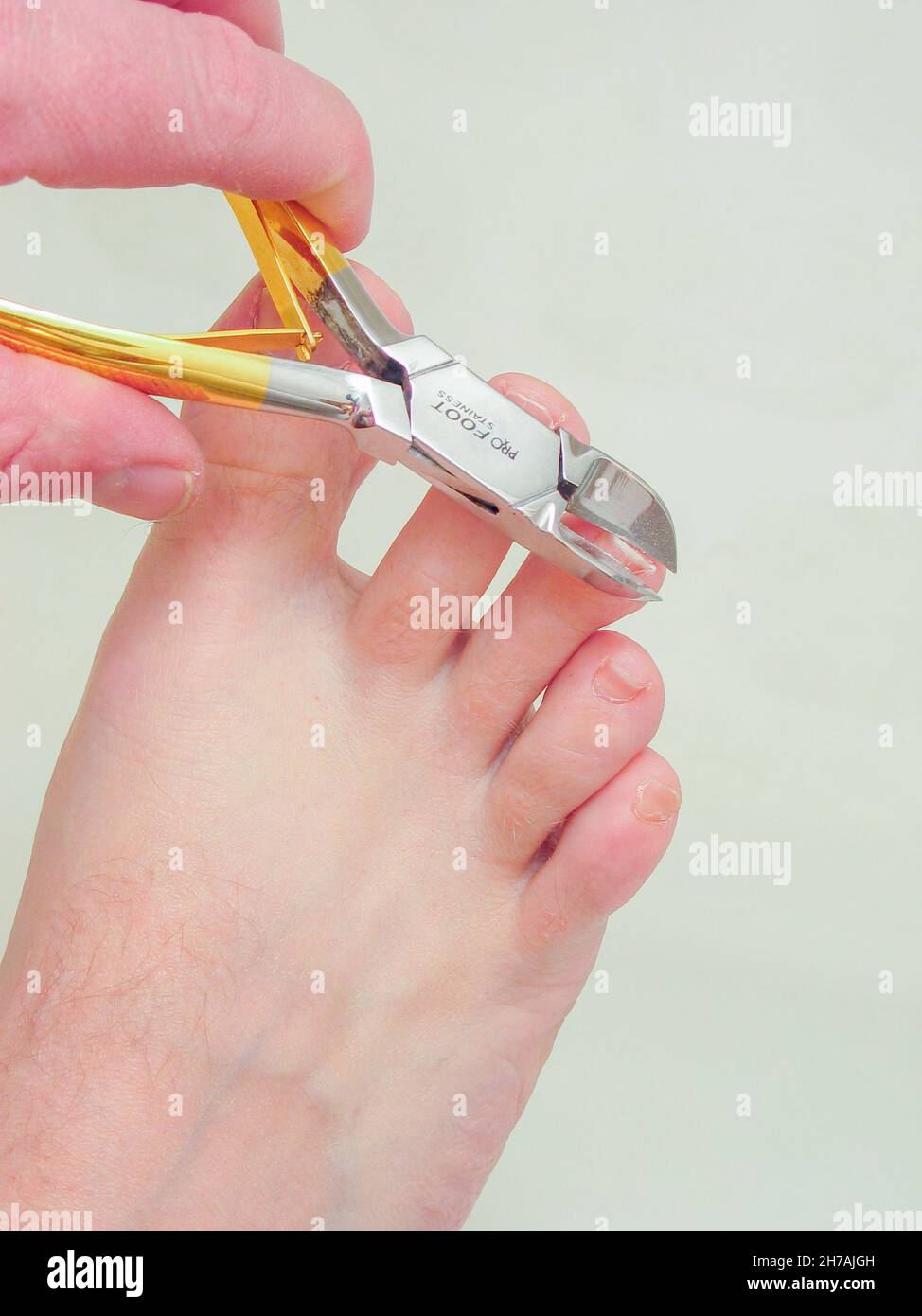 Toenail clippers in use. Stock Photo
