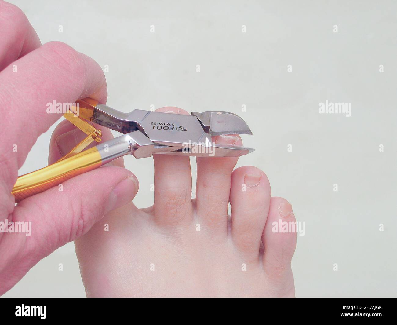 Toenail clippers in use. Stock Photo