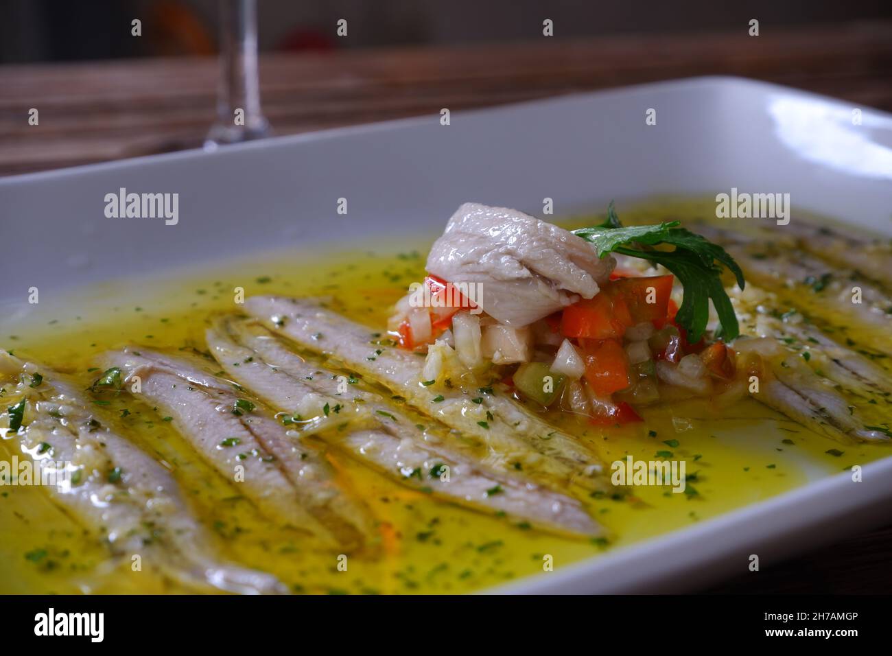 Anchovies with olive oil and pepper in a restaurant Stock Photo Alamy