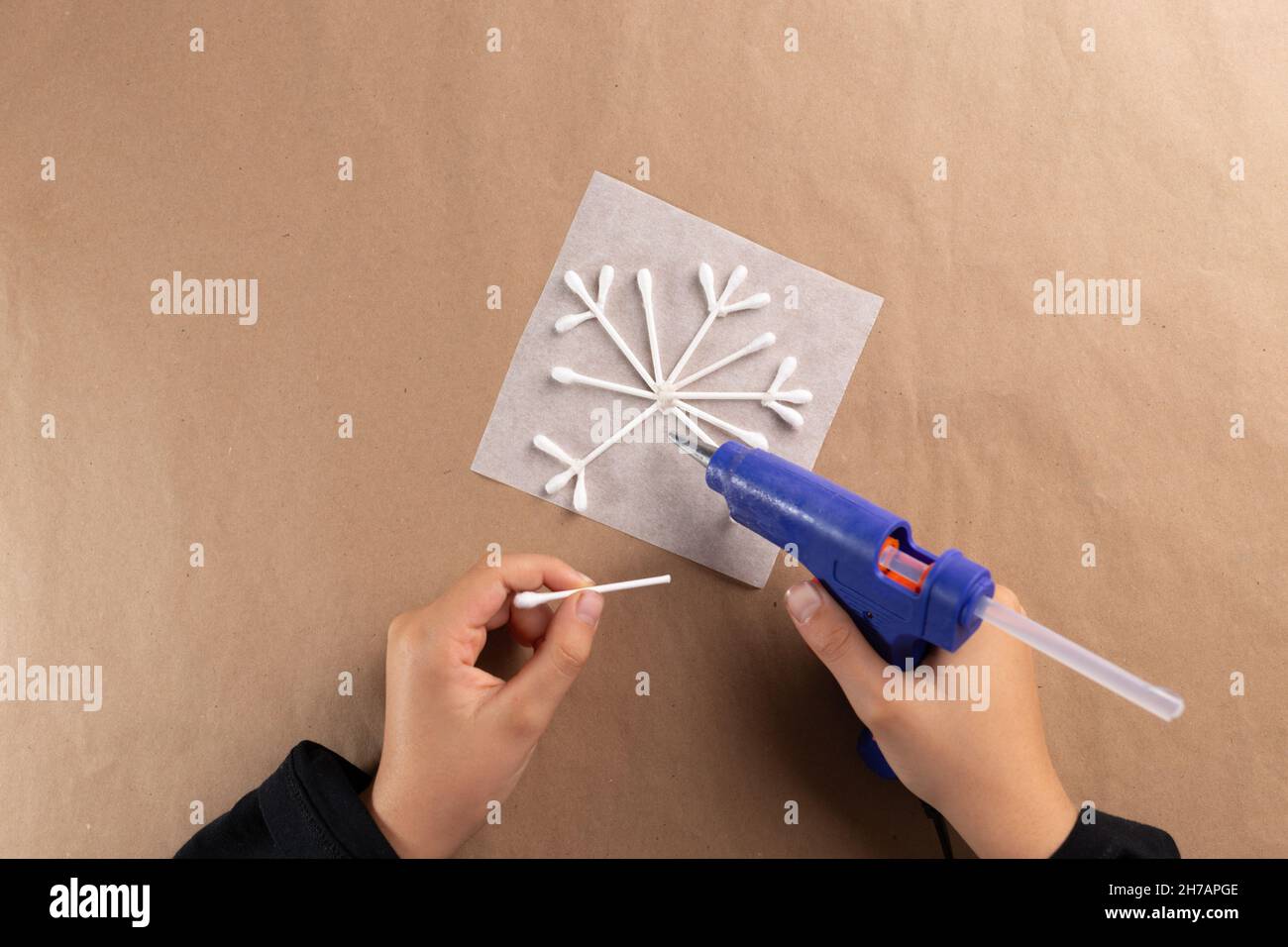 cotton swab snowflake craft for kids, Christmas activity for preschooler  Stock Photo - Alamy