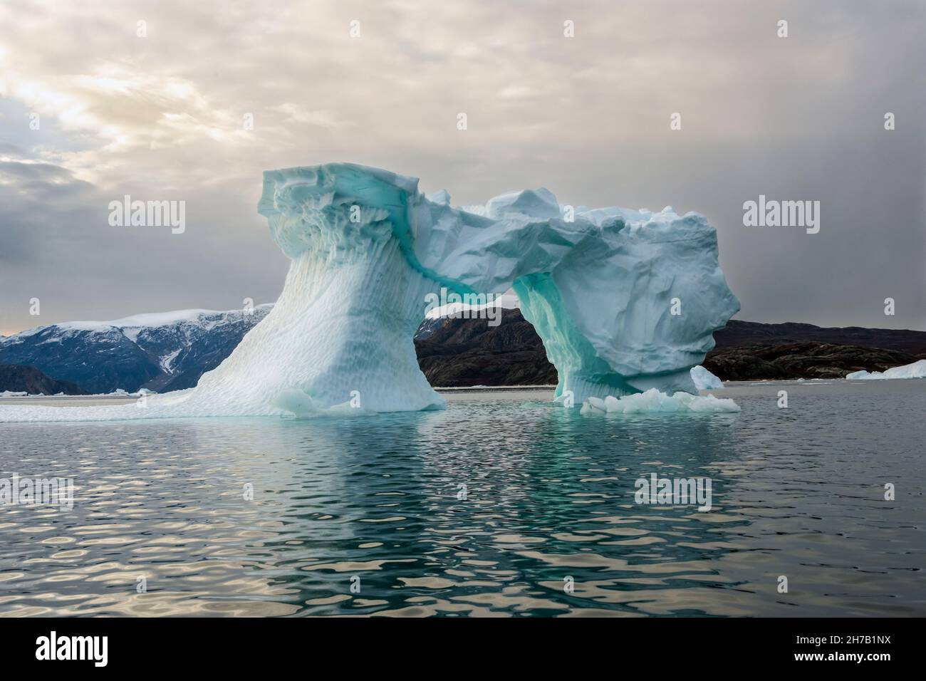 Blue ice arch, Rypefjord, Scoresby Sund, East Greenland Stock Photo