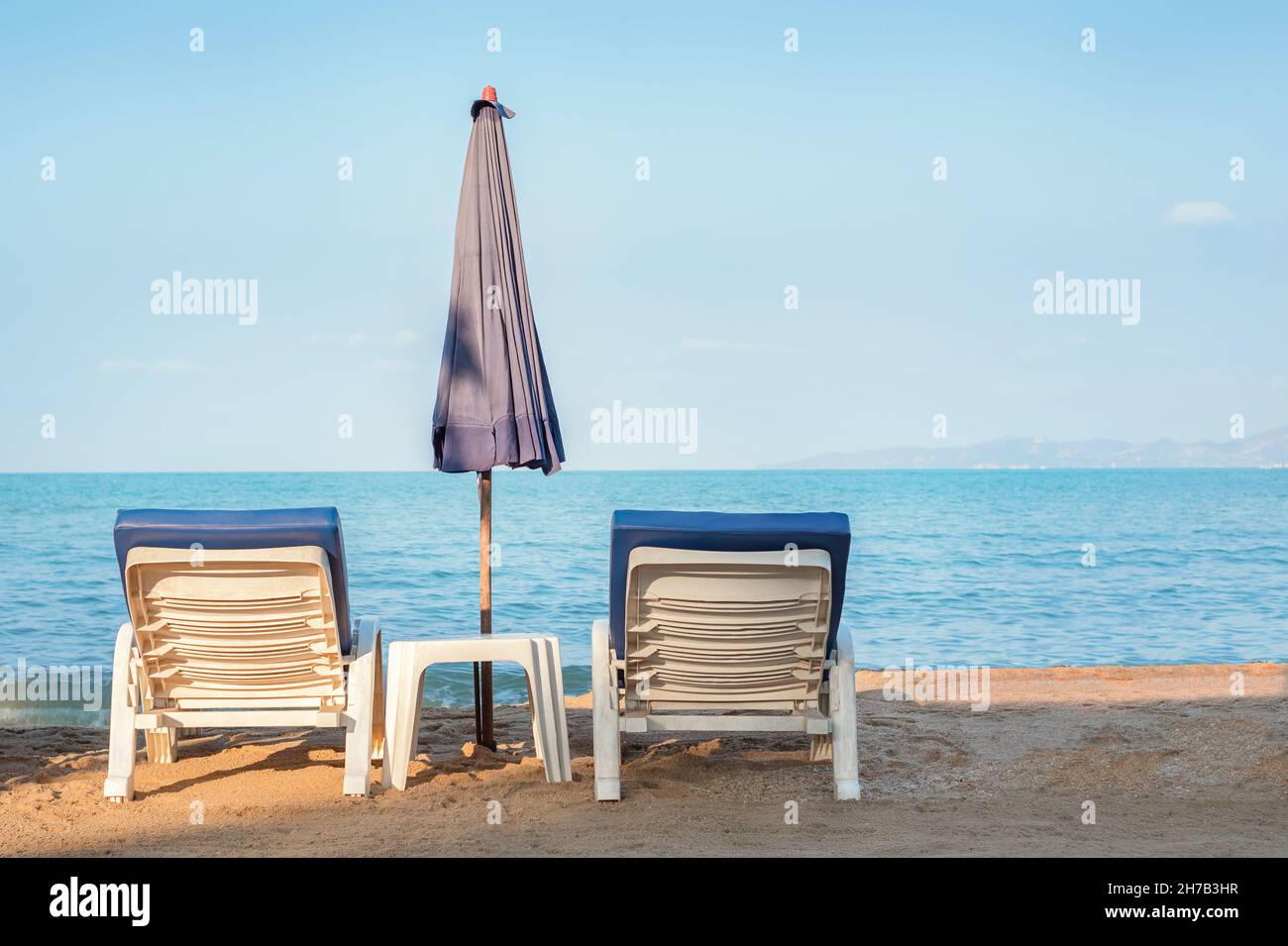 Two sun loungers on the beach. Sunbathing area Stock Photo Alamy