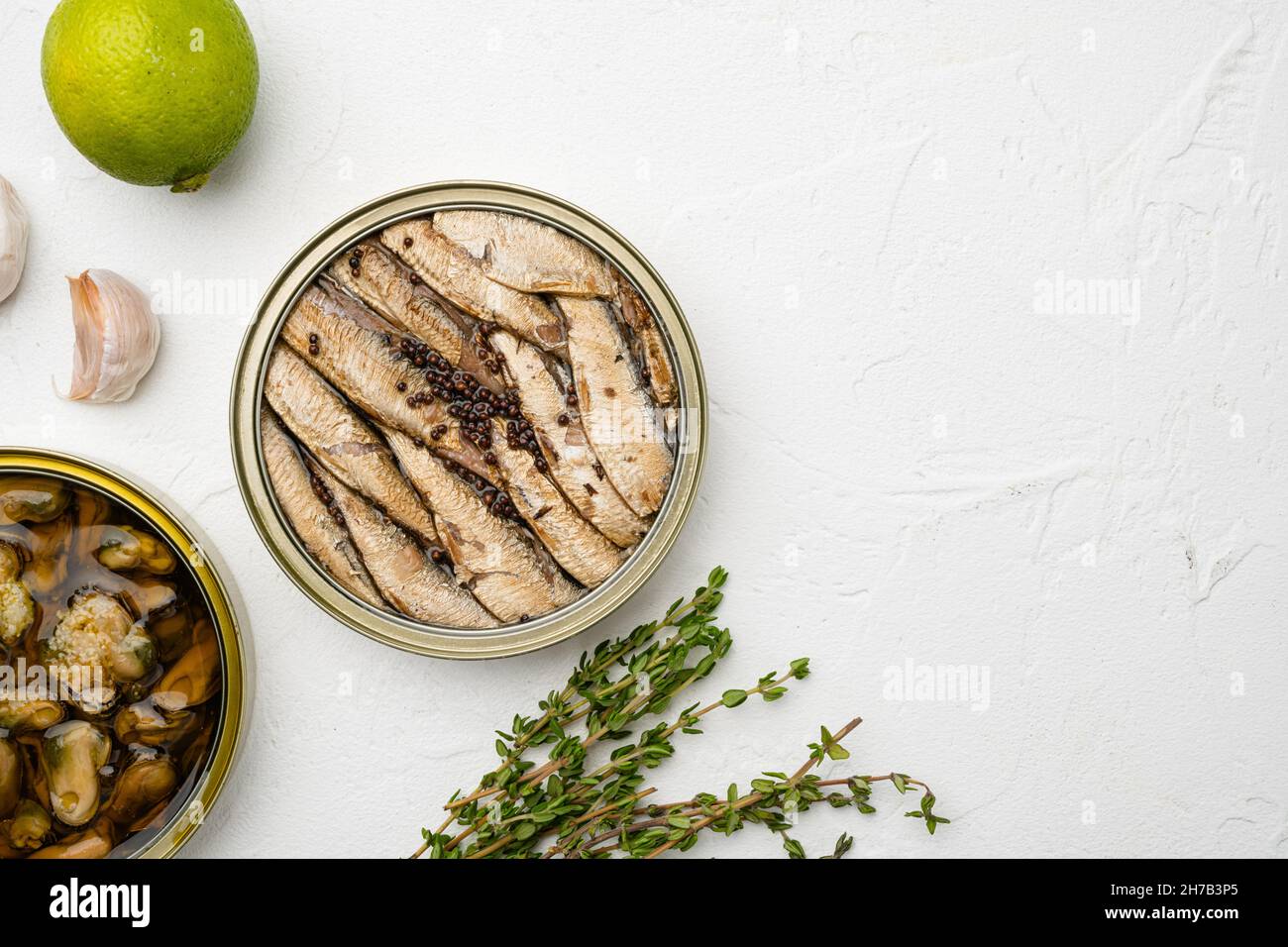 Tin Can Of Sprats Sardines Set On White Stone Table Background Top tin-can-of-sprats-sardines-set-on-white-stone-table-background-top