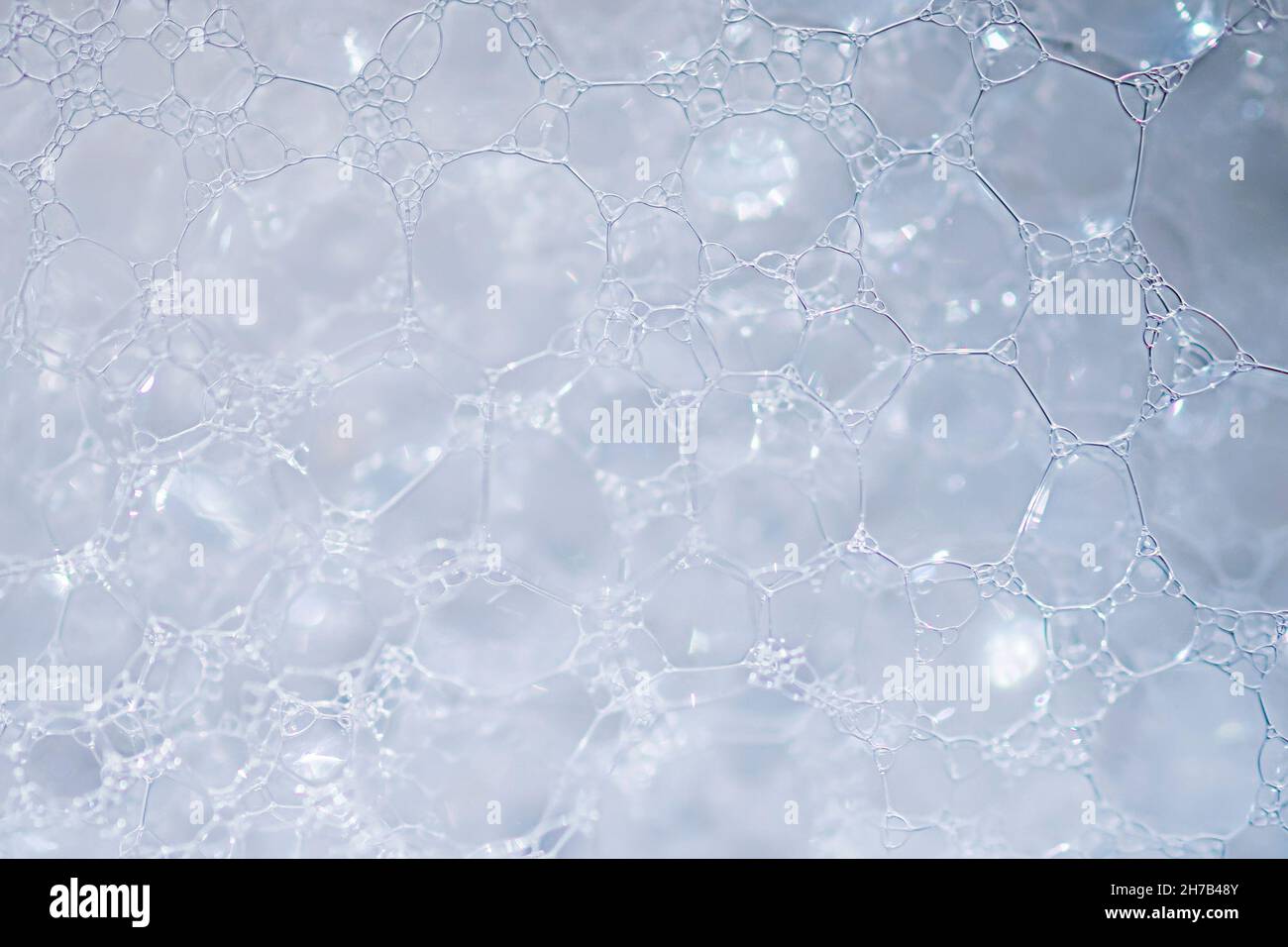 white foam texture with bubbles. soft bubbles background on the cap Stock Photo