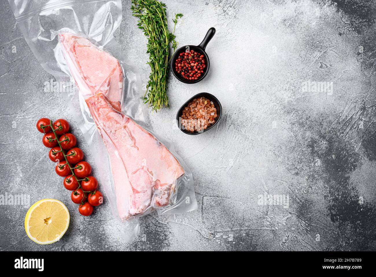 Perch frozen fish meat pack set, with herbs, on gray stone table ...