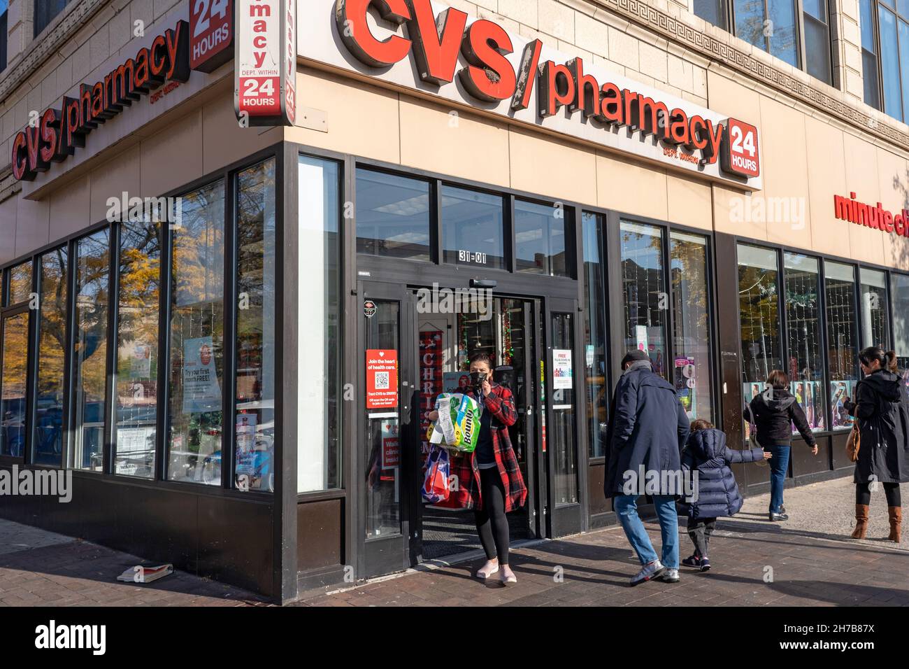 Shoppers visit a CVS store in Astoria in Queens Borough of New York City.  CVS Health is closing 900 stores nationwide over the next three years in  response to 'changing buying patterns