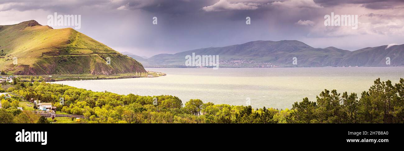 Dramatic panoramic view during stormy weather with strong wind on Lake Sevan. Natural travel destinations in Armenia Stock Photo