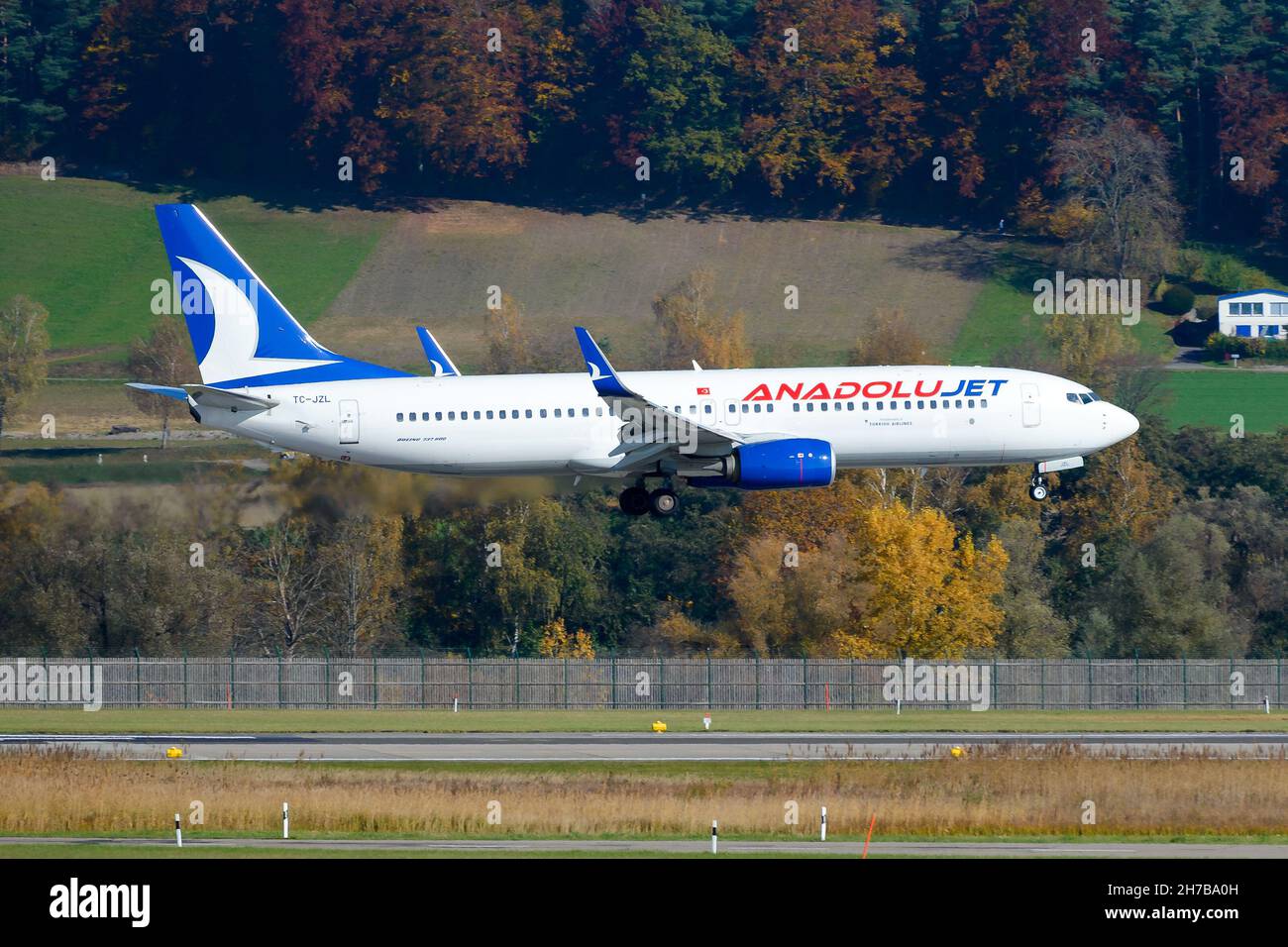 Anadolu Jet Boeing 737 aircraft landing from Turkey. Airplane B737 of AnadoluJet landing. Plane registered as TC-JZL. Stock Photo