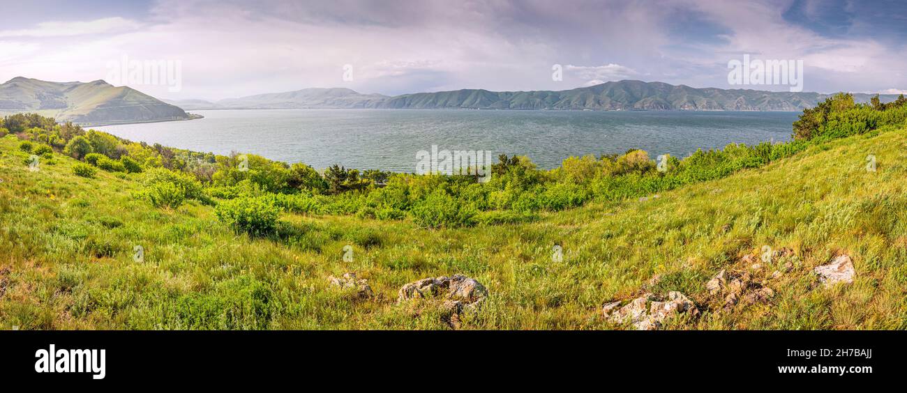 Dramatic panoramic view on Lake Sevan after heavy storm. Natural travel destinations in Armenia Stock Photo
