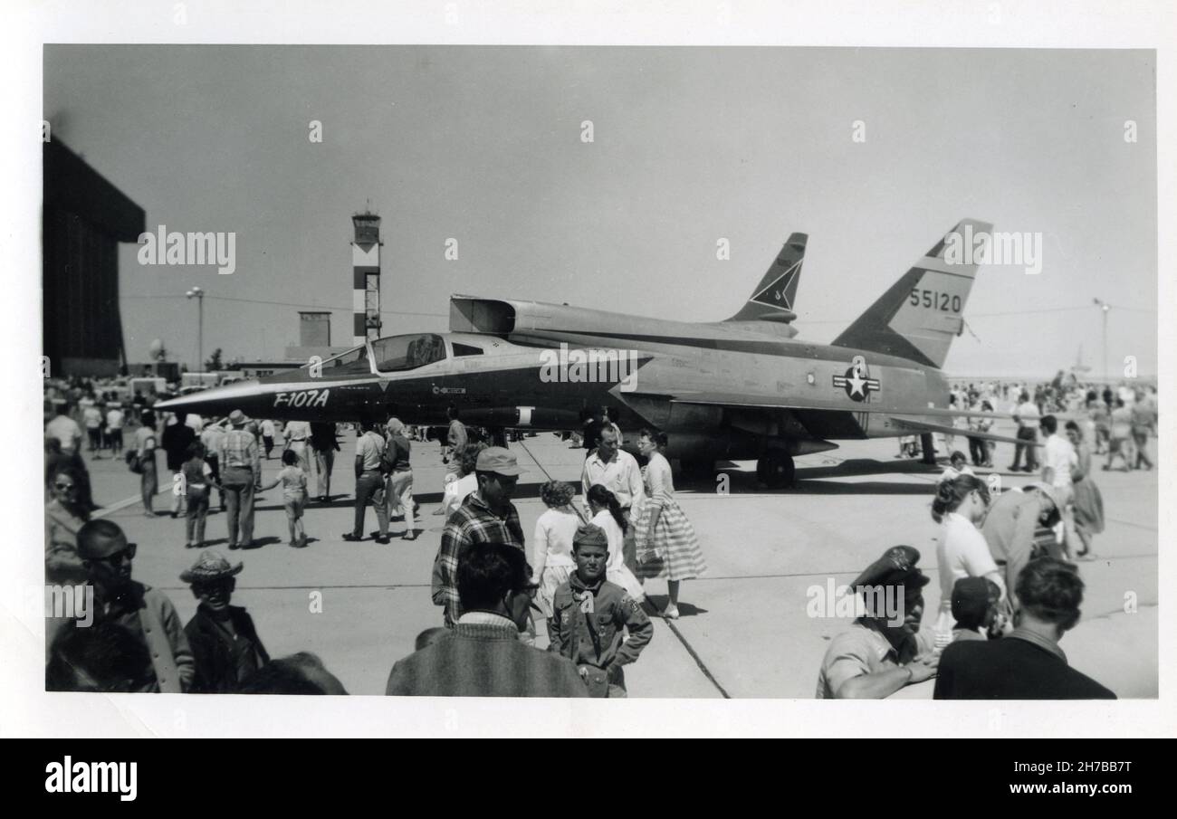 Aviation enthusiasts view a United States Airforce F-107A manufactured by North American Aviation on display during an air show in Southern California during May 1959. F-107A was the Military designation for nine prototype NA-212s ordered, only three were built. The aircraft here has is tail number 55120 Stock Photo