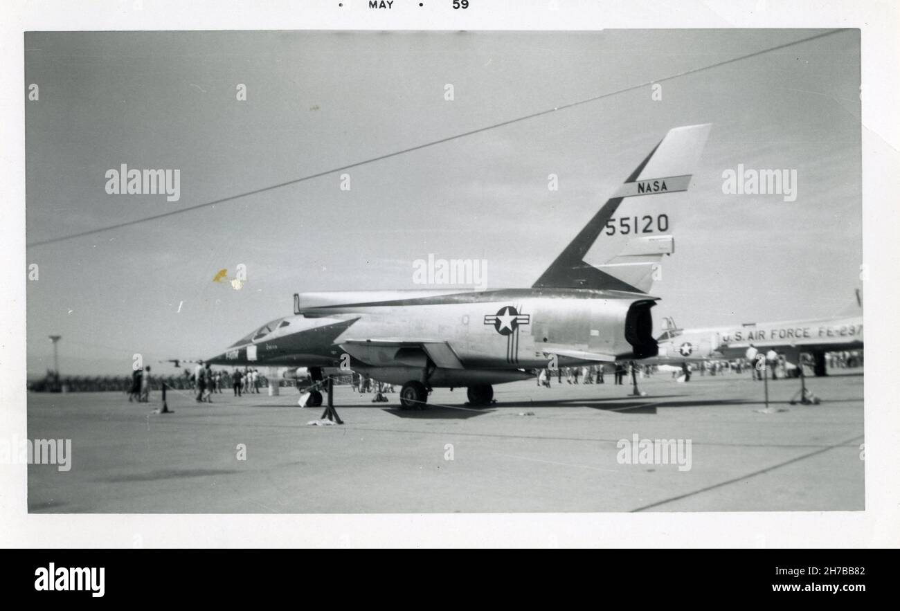 Aviation enthusiasts view a United States Airforce F-107A manufactured by North American Aviation on display during an air show in Southern California during May 1959. F-107A was the Military designation for nine prototype NA-212s ordered, only three were built. The aircraft here has is tail number 55120 Stock Photo