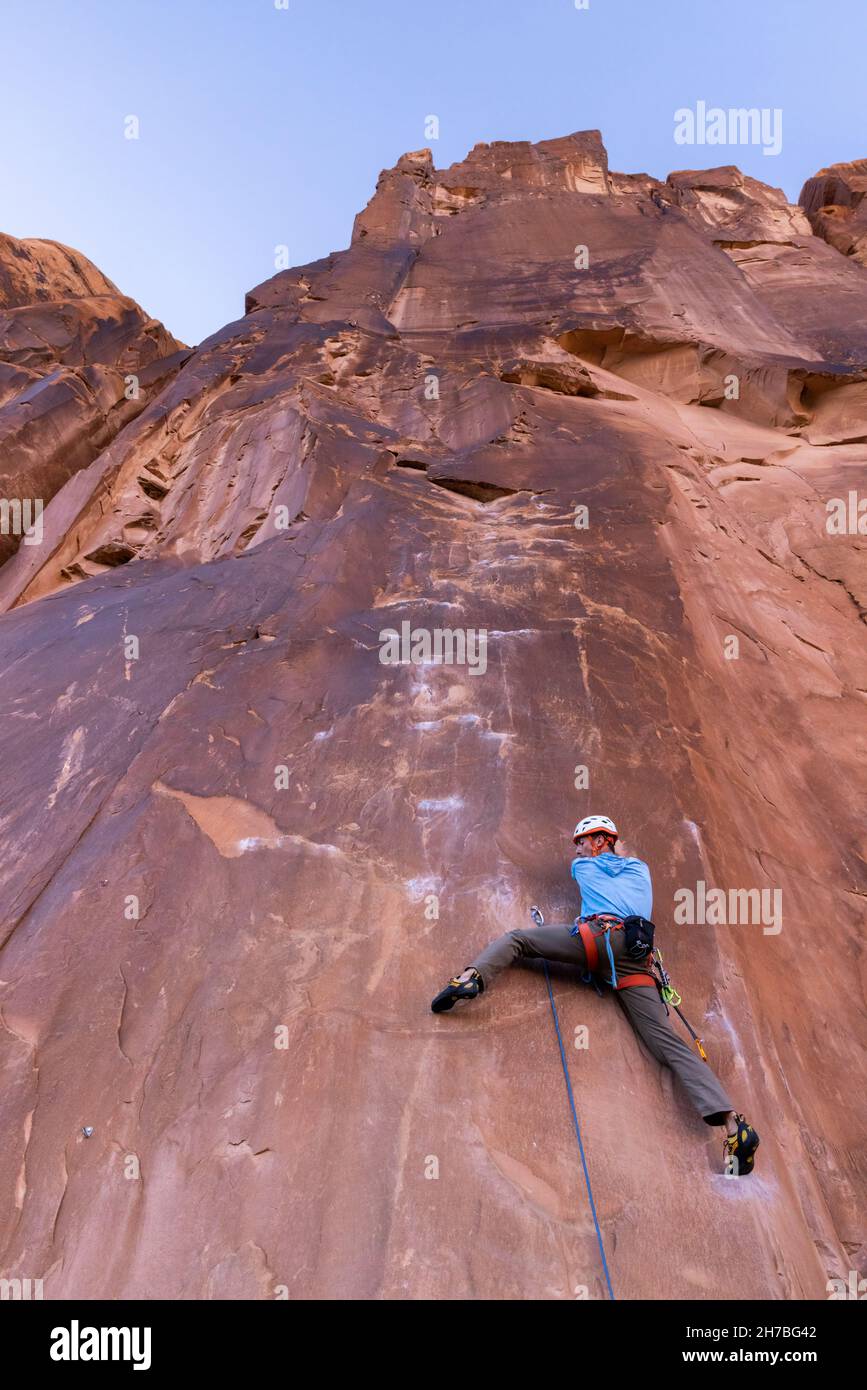 Rock climbers on sandstone cliff near Moab, Utah Stock Photo Alamy