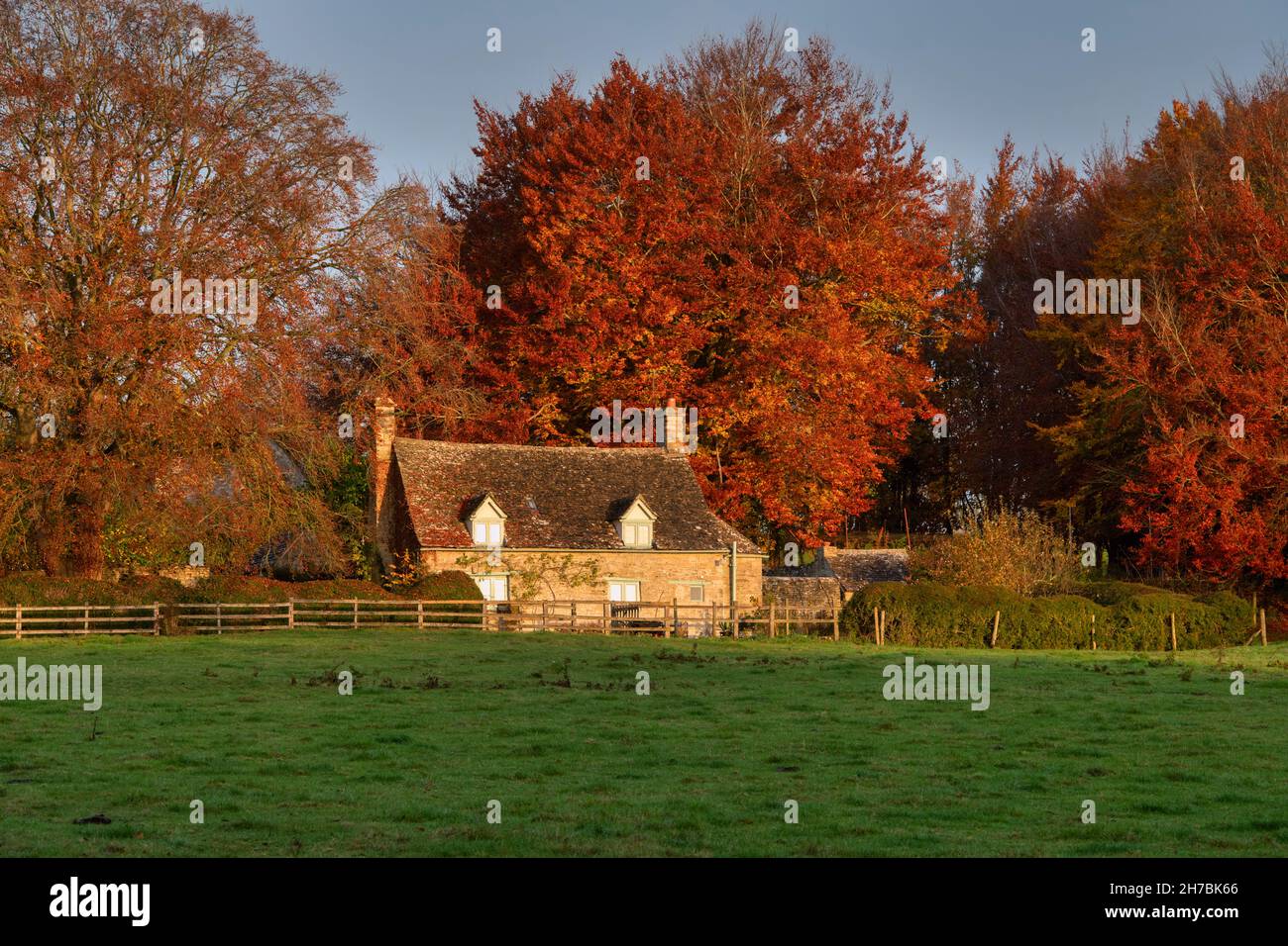 Sunrise over a cotswold cottage in autumn. Widford, Cotswolds, Oxfordshire, England Stock Photo