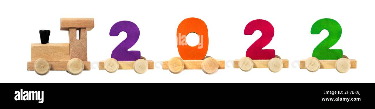 2022 happy new year,wooden toy train carrying numbers. Locomotive, wooden train, toy. Children s school concept. Educational games Stock Photo