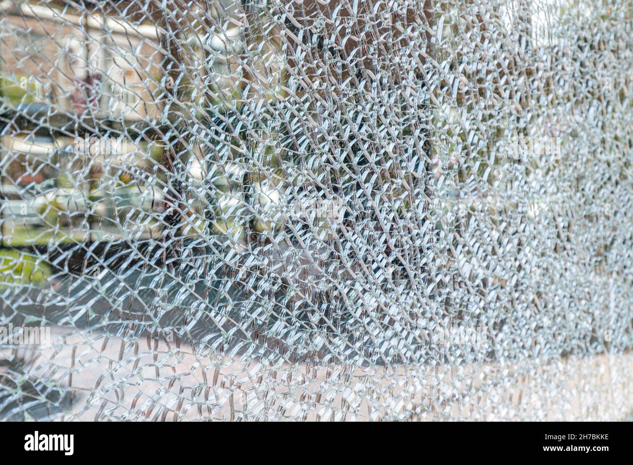 broken glass triplex close-up on a city street. crime and theft concept Stock Photo