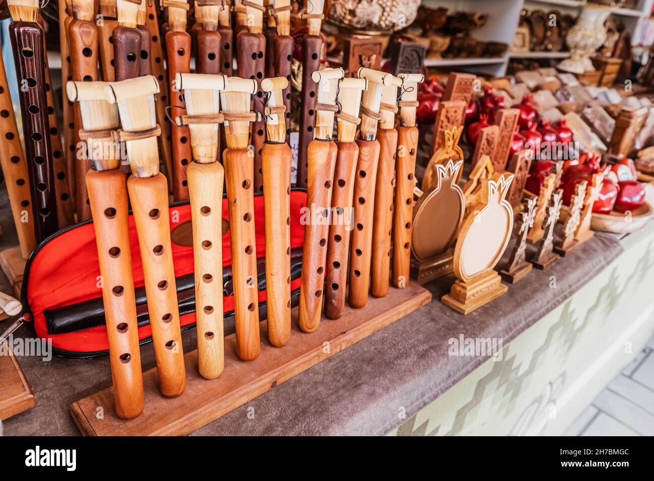 The assortment of duduk for sale on the shelves of the souvenir shop. Traditional Armenian brass