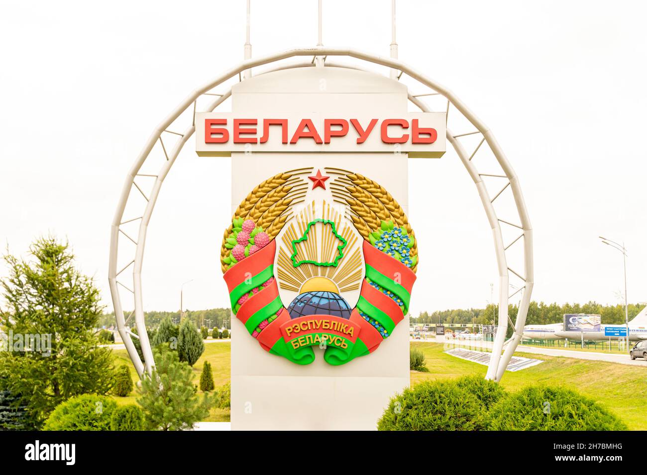 Belarus large coat of arms on a big round stand at the Minsk airport premises Stock Photo