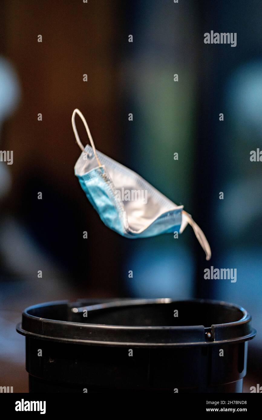 mask in bin, rubbish, garbage and trash. Littering a safety mask in ...