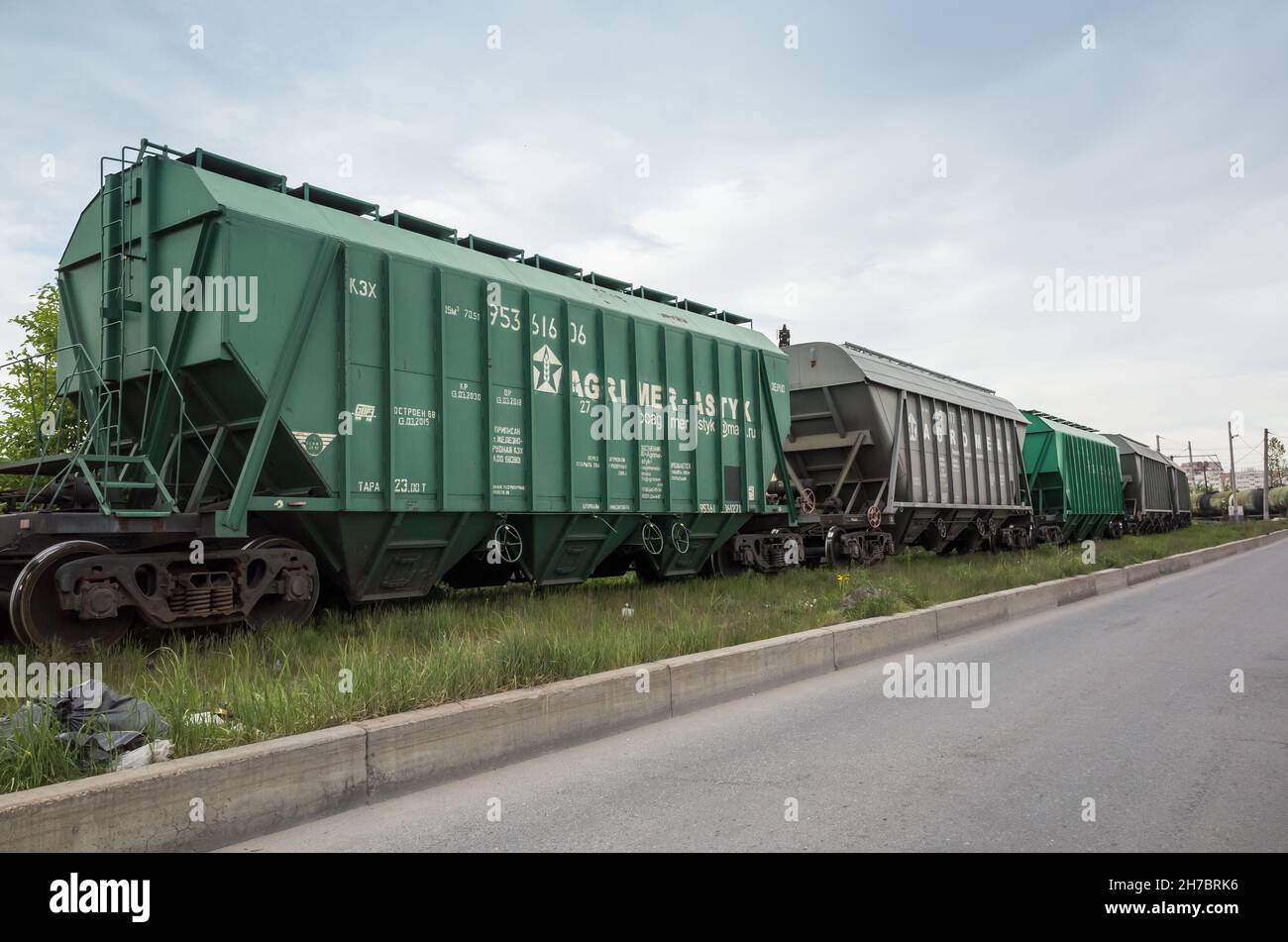 St-Petersburg, Russia - June 8, 2017: Green industrial cargo railway cars stand on a railroad on a daytime Stock Photo