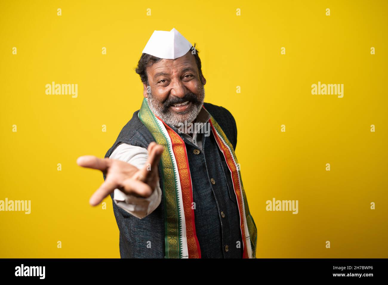 Politician laughing out loud by showing hands towards camera - concept of mockery, teasing and ridiculous funny smile. Stock Photo