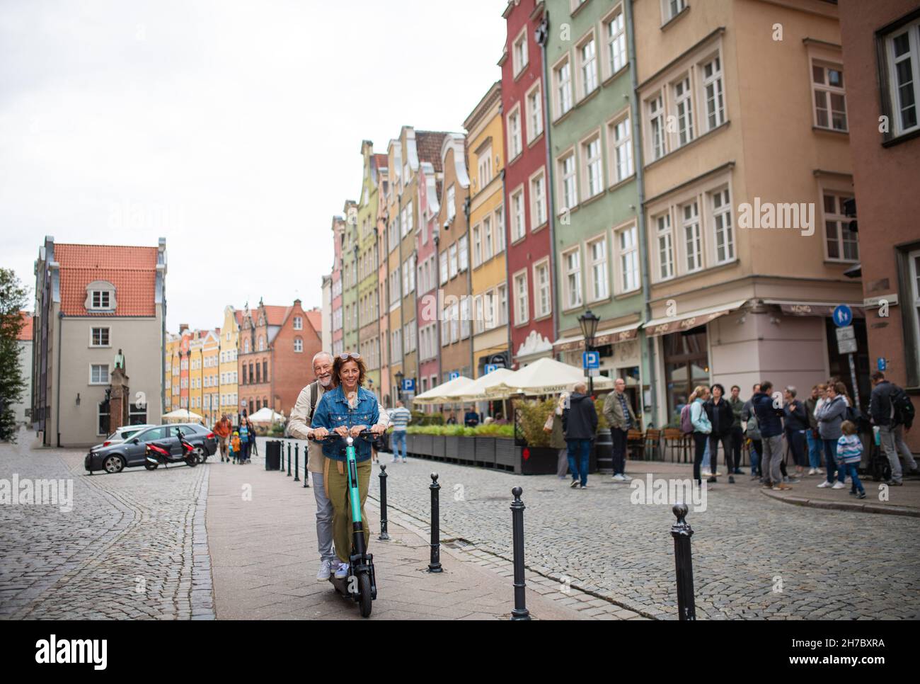 Happy man riding a scooter hi-res stock photography and images - Alamy